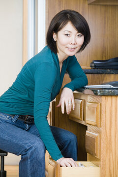 Portrait of a mid adult woman smiling in the kitchen