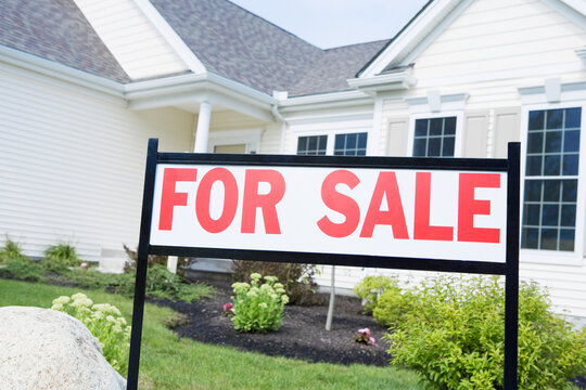 For Sale signboard in front of a house