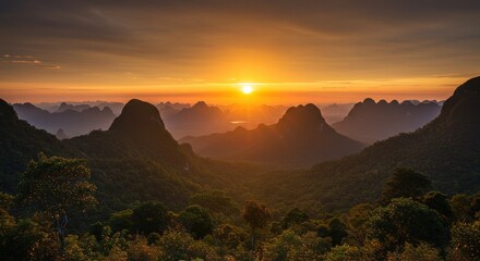 Obraz premium Sunset over mountain range landscape.