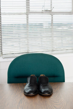 Close up of shoes on a desk