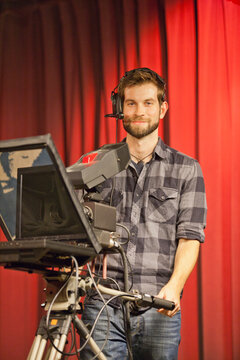 TV producer at teleprompter in a TV studio