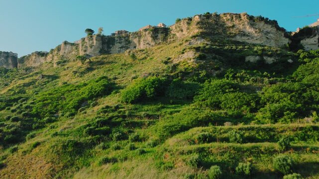 Climbing towards the medieval village of Gerace in Calabria from a steep cliff
