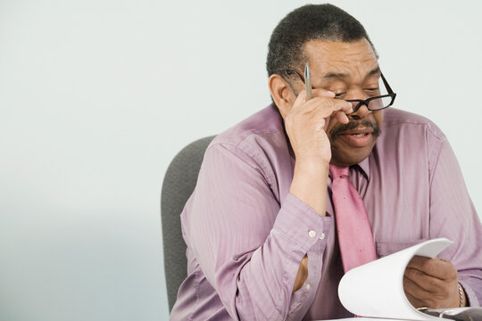 Businessman looking at documents in an office