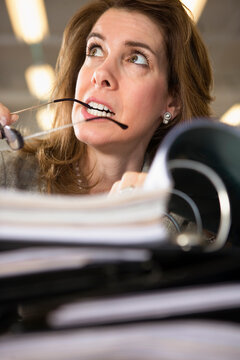 View of a woman tensed with workload