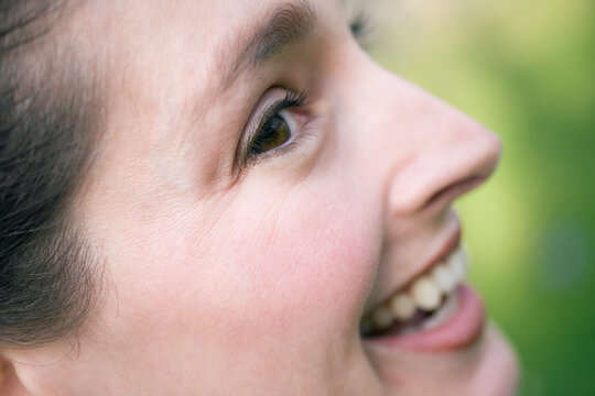 Side view of a young woman smiling