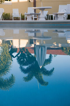 Reflection of a tourist resort in a swimming pool