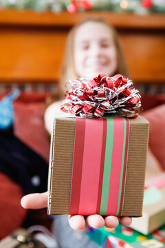 Close up of a gift held by a girl