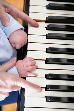 Close up of hands on a piano keyboard