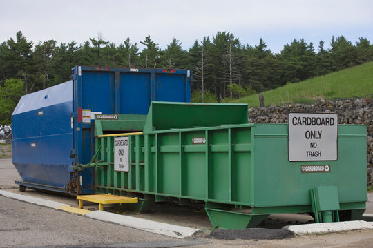 Cardboard Only recycling container connected to compactor