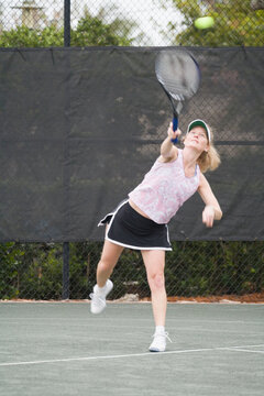 Senior woman playing tennis