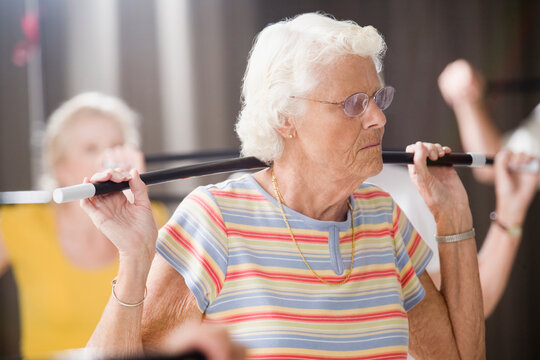 Close-up of a senior woman exercising in an exercise class