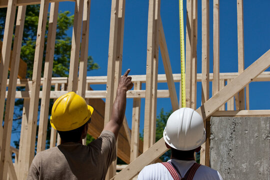 Carpenters planning at a construction site
