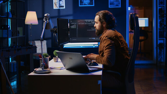 Developer pressed by deadline, drinking coffee and doing multitasking to finish developing PC code.