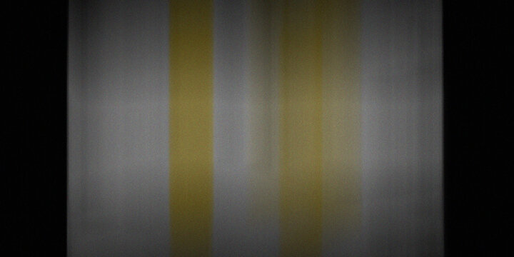 Vintage super 8 film grain texture with faded vertical yellow and white stripes and dark vignettes creating an old effect.