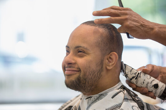 Man with Down Syndrome getting a hair cut