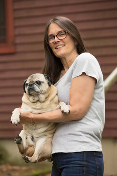 Woman with Multiple Sclerosis holding her dog