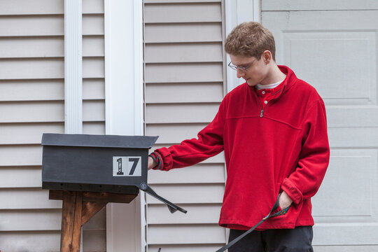 Man with Anxiety Disorder checking his mailbox