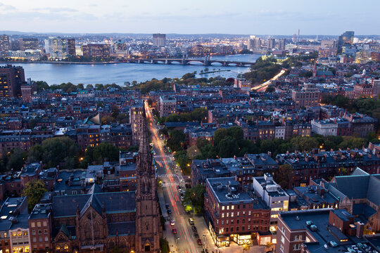 High angle view of Back Bay Boston, Berkeley Street and The Charles River at dusk