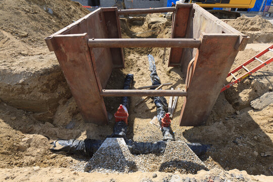 Trench shield over new water pipe installation
