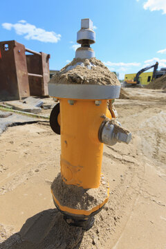 Water hydrant installation with trench shield in background