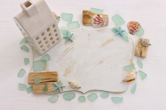 summer background with blue sea glass and shells