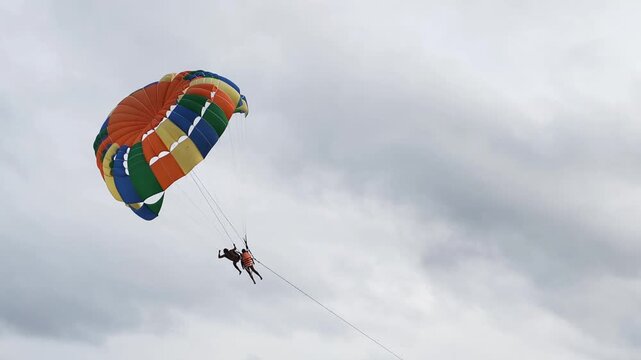 Beautiful tropical resort tourism offers unforgettable memories during summer holidays. Engaging in tropical resort tourism allows people enjoy colorful parasailing flights high above scenic coastline