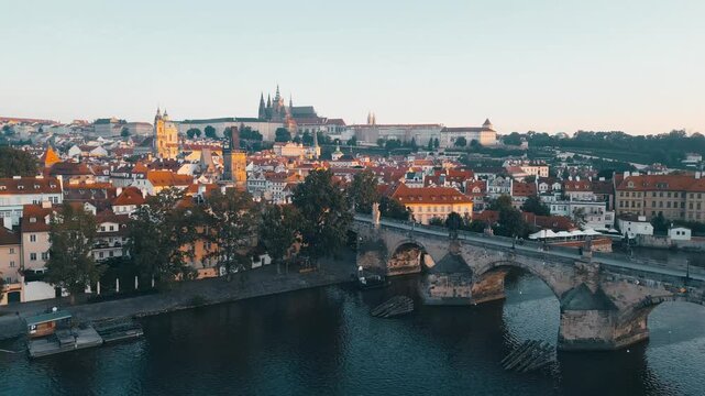 Experience the beauty of Prague at sunrise, showcasing the stunning architecture of Prague Castle and the iconic Charles Bridge. Enjoy the serene morning atmosphere along the Vltava River.