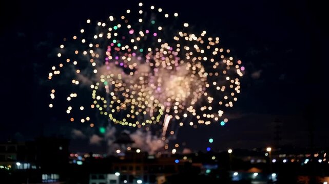 Spectacular Fireworks Display Illuminates the Night Sky Over Cityscape.