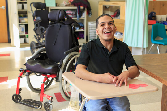 Boy with Spastic Quadriplegic Cerebral Palsy learning at school