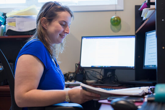 Young Woman with Cerebral Palsy working at her computer