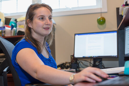 Young Woman with Cerebral Palsy working at her computer