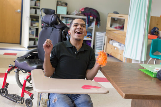 Boy with Spastic Quadriplegic Cerebral Palsy learning at school