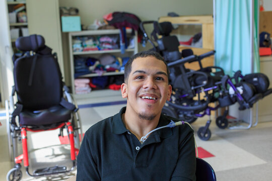 Boy with Spastic Quadriplegic Cerebral Palsy learning at school