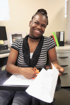 Teen with Cerebral Palsy working in an office