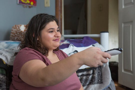 Girl with Cerebral Palsy using a remote