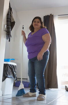 Girl with Cerebral Palsy sweeping