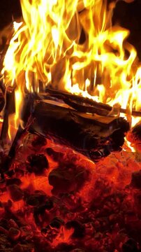 Close up of Burning Logs and Glowing Flames