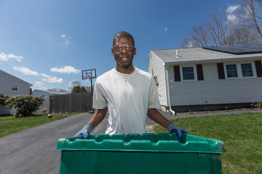 Man with Williams Syndrome taking out the trash
