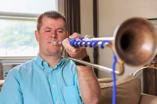 Musician with Visual Impairment playing bugle