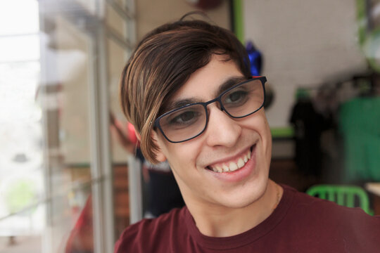 Young man with Fragile X Syndrome working in a restaurant