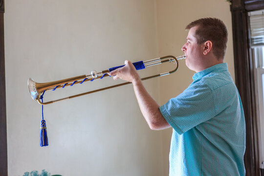 Musician with Visual Impairment playing bugle