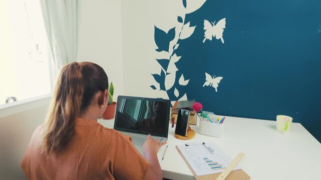 Professional businesswoman working remotely from her home office