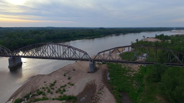 Industrial rusty old steel train bridge, aerial view.