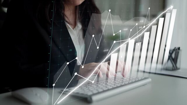A businesswoman engages with her keyboard, analyzing financial market trends through digital graphs and charts, symbolizing growth and market insights. Copula
