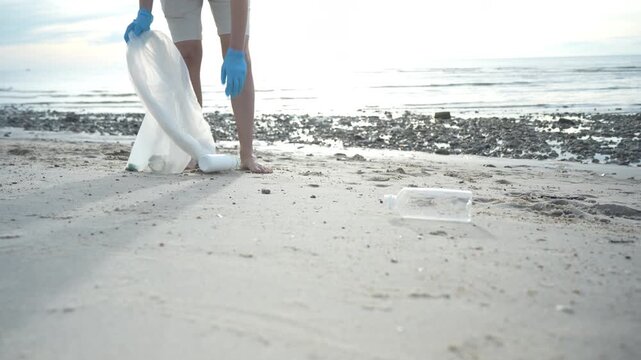 Save ocean. Volunteer pick up trash garbage at the beach and plastic bottles are difficult decompose prevent harm aquatic life. Earth, Environment, Greening planet, reduce global warming, Save world