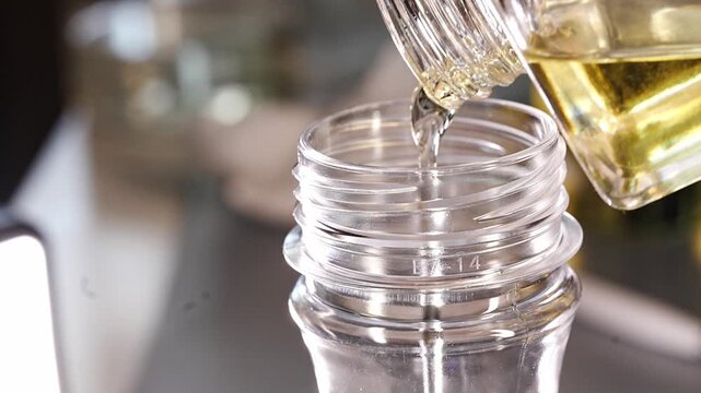 Pouring essential oil for aroma diffuser