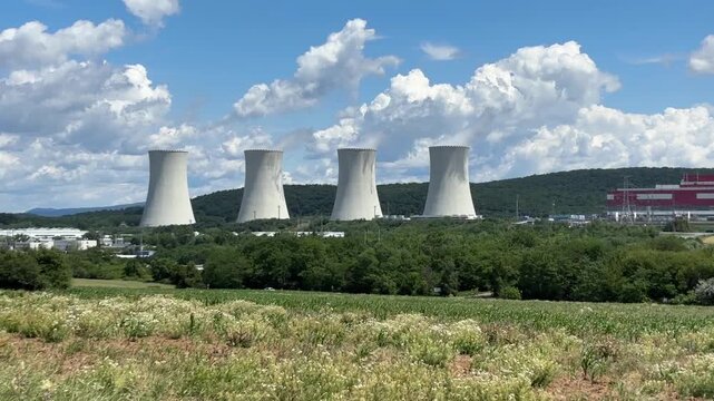 nuclear power plant background blue sky surface close up of cooling towers emitting steam industrial product concept of green energy, atomic station, electricity generation