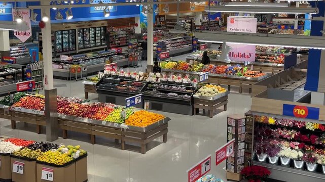 Brightly arranged fruits and flowers shine in a bustling superstore in Halifax, Nova Scotia. Experience the lively atmosphere of vibrant shopping and fresh finds