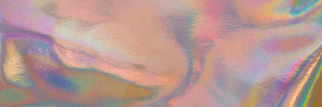 Colorful reflections appear on a surface creating a blend of hues seen in natural light