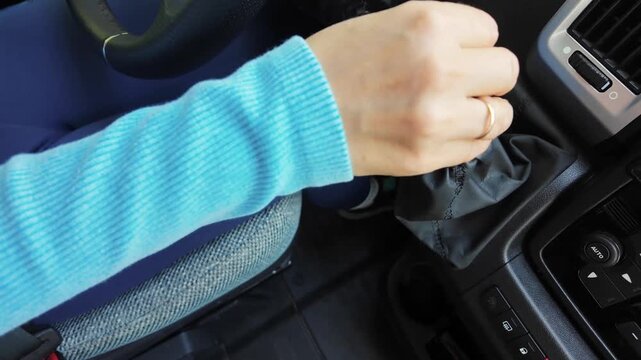 Woman Shifting Manual Gear Lever in Camper Van. Close Up Driving a Motorhome.